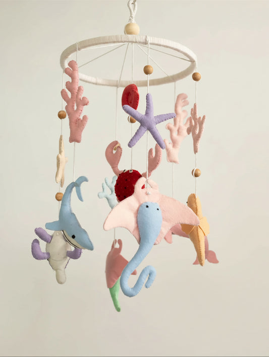 Deep in the Ocean premium handcrafted felt crib mobile with charming marine animals and coral accents, perfect for elegant coastal-inspired baby nursery décor.