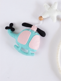 Soft handcrafted felt helicopter ornament from the Fly High nursery mobile, created for modern baby rooms with aviation-inspired décor.