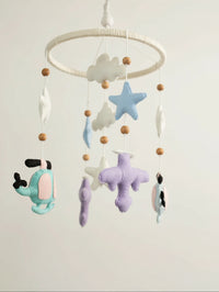 Fly High premium handcrafted felt baby mobile with pastel helicopters, airplanes, clouds, stars, and moon, beautifully styled for elegant nursery décor.