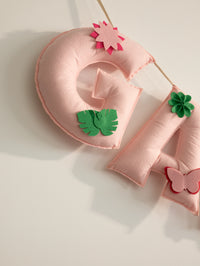 Close-up of the Garvita felt letter G featuring handcrafted floral details and soft pastel stitching for luxury nursery decor.