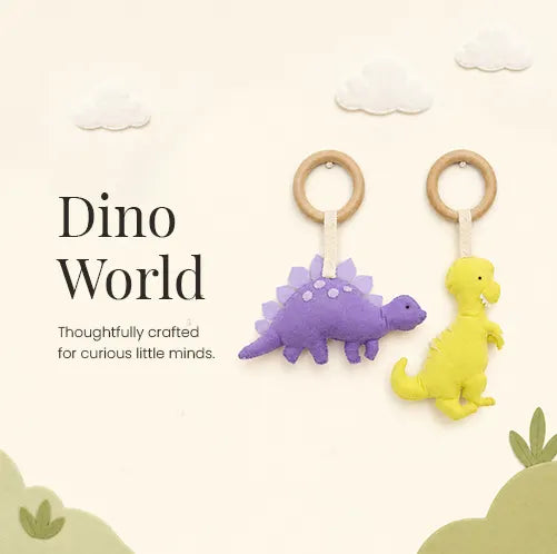 Handmade felt purple stegosaurus and yellow T-Rex dinosaur baby gym hanging toys with wooden rings — thoughtfully crafted soft plush accessories for newborns and infants