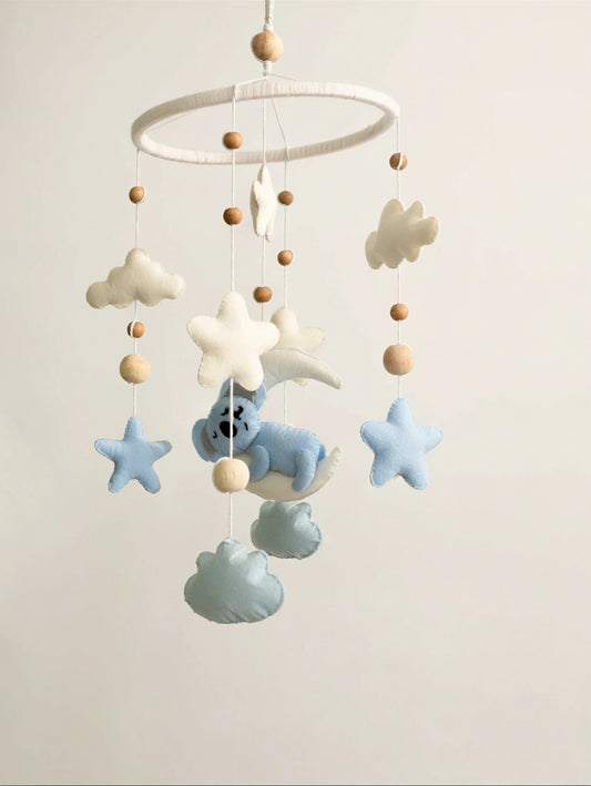 Sleep Tight premium handcrafted baby cot mobile featuring a sleeping koala, fluffy clouds, soft stars, crescent moon, and wooden bead accents for modern nursery styling.