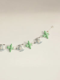 Detailed right-side view of the To The Moon nursery garland with stitched felt helicopters and airplanes for aviation-themed baby decor.