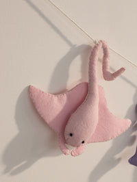 Close-up of a handcrafted pink felt stingray from the Under the Sea nursery banner with soft stitched details for ocean-themed baby room decor.